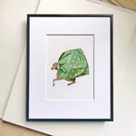Dog with green cape